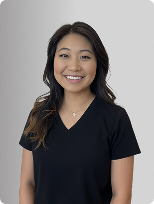 Agnes Choo, MSN, APRN, FNP-C, Nurse Practitioner at Fem Excel, smiling in black medical uniform.