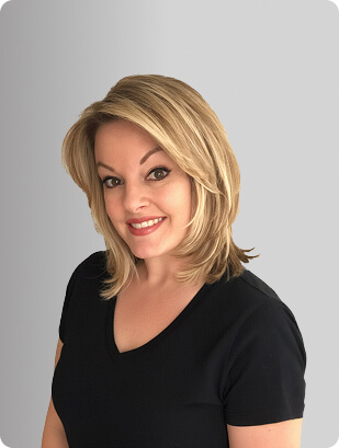 Jeni-Lyn Calabro, APRN, Nurse Practitioner at Fem Excel, smiling in black medical uniform.