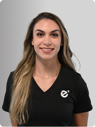 Nicole Mabardi, MSN, NP-C, Nurse Practitioner at Fem Excel, smiling in black medical uniform.