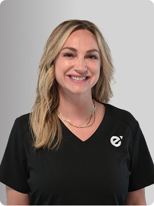 Grace Oropesa, MSN, APRN, FNP-C, Nurse Practitioner at Fem Excel, smiling in black medical uniform.