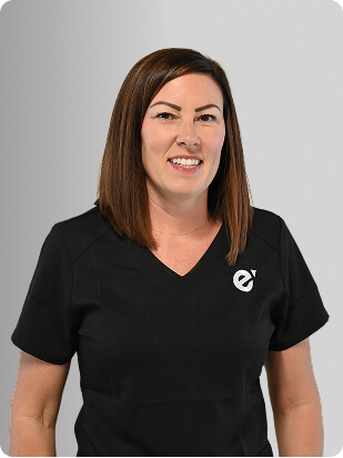 Jana Mervine, APRN, Nurse Practitioner at Fem Excel, smiling in black medical uniform.