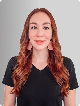 Christina Walker, FNP, Nurse Practitioner at Fem Excel, smiling in black medical uniform.