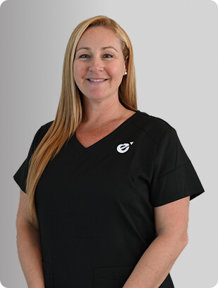 Kelley Wyant, MSN, RN, NP-C, Nurse Practitioner at Fem Excel, smiling in black medical uniform.