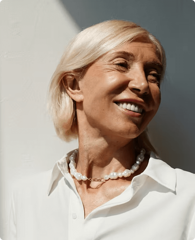 calm, optimized woman smiling after menopause