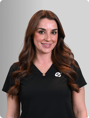 Andrea Mayfield, MSN, APRN, FNP-C, Nurse Practitioner at Fem Excel, smiling in black medical uniform.