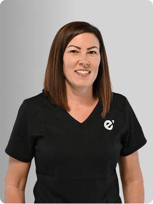 Jana Mervine, APRN, Nurse Practitioner at Fem Excel, smiling in black medical uniform.