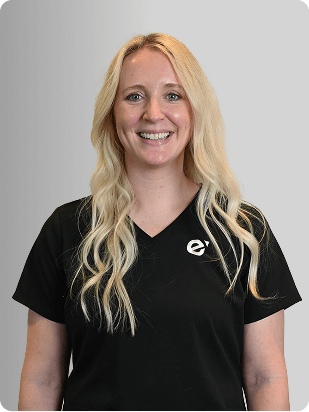 Meaghan Reilly, MSN, APRN, FNP-C, Nurse Practitioner at Fem Excel, smiling in black medical uniform.