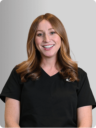 Rosalie Sirianno, MSN, APRN, FNP-C, Nurse Practitioner at Fem Excel, smiling in black medical uniform.