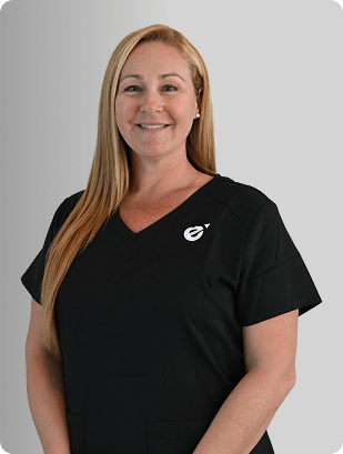 Kelley Wyant, MSN, RN, NP-C, Nurse Practitioner at Fem Excel, smiling in black medical uniform.