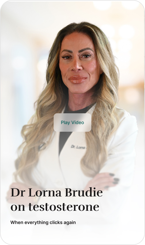 Dr. Lorna, a woman with long blonde hair, posing in a white lab coat with her arms crossed.