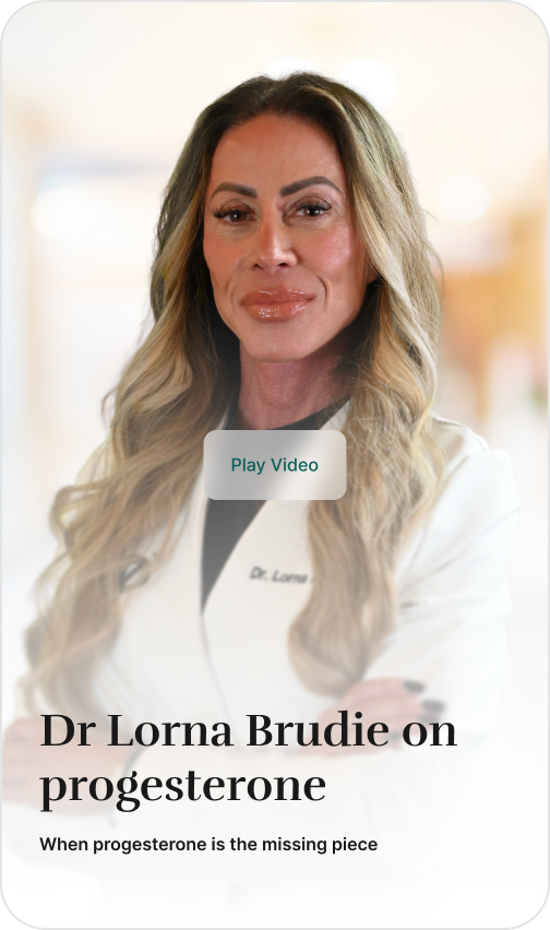 Dr. Lorna, a woman with long blonde hair, posing in a white lab coat with her arms crossed.