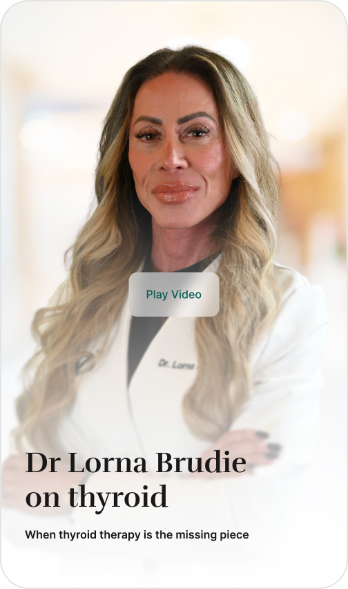 Dr. Lorna, a woman with long blonde hair, posing in a white lab coat with her arms crossed.