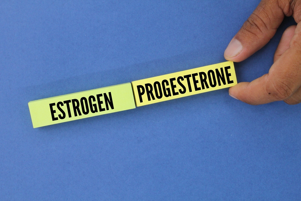 colored paper with the words estrogen and progesterone