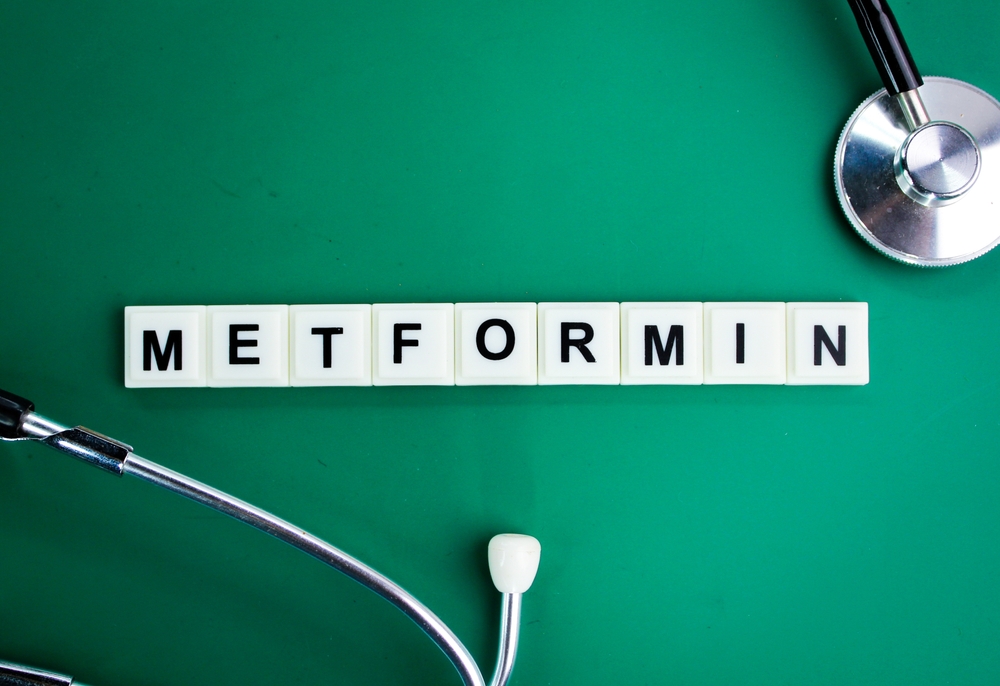 stethoscope and alphabet letters with the word Metformin