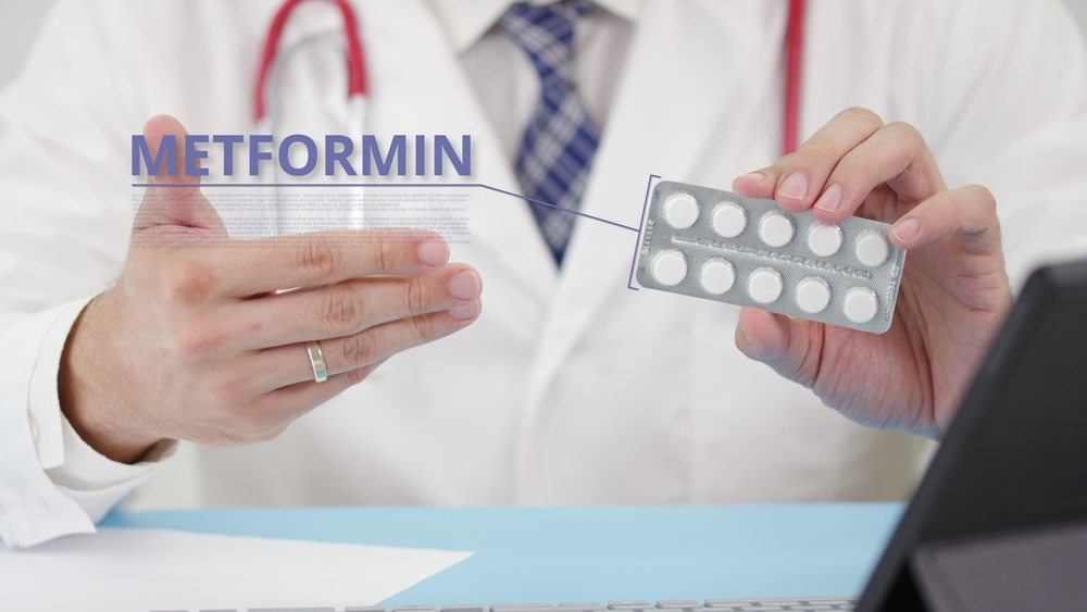 Medical doctor holding Metformin tablets in his hands