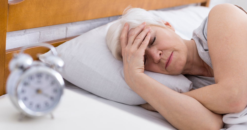 Worried senior woman suffering from insomnia due to menopause