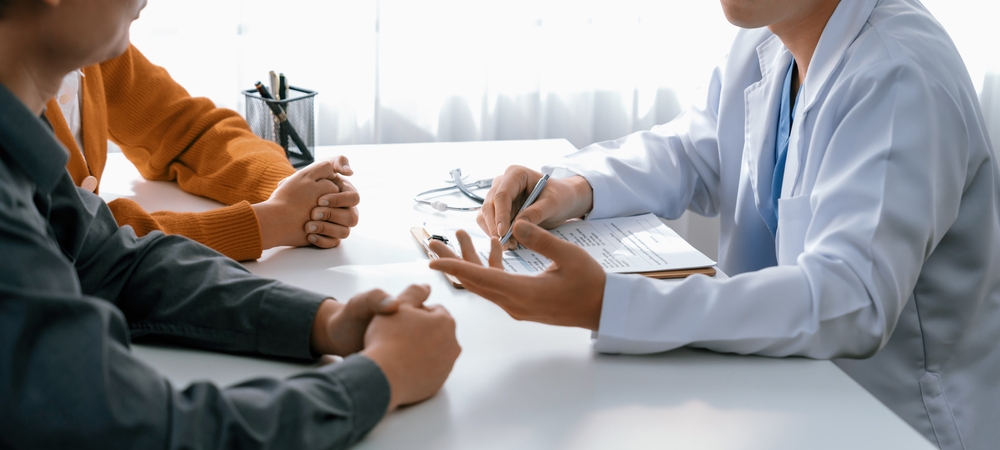 Couple attend fertility consultation with specialist at a hospital